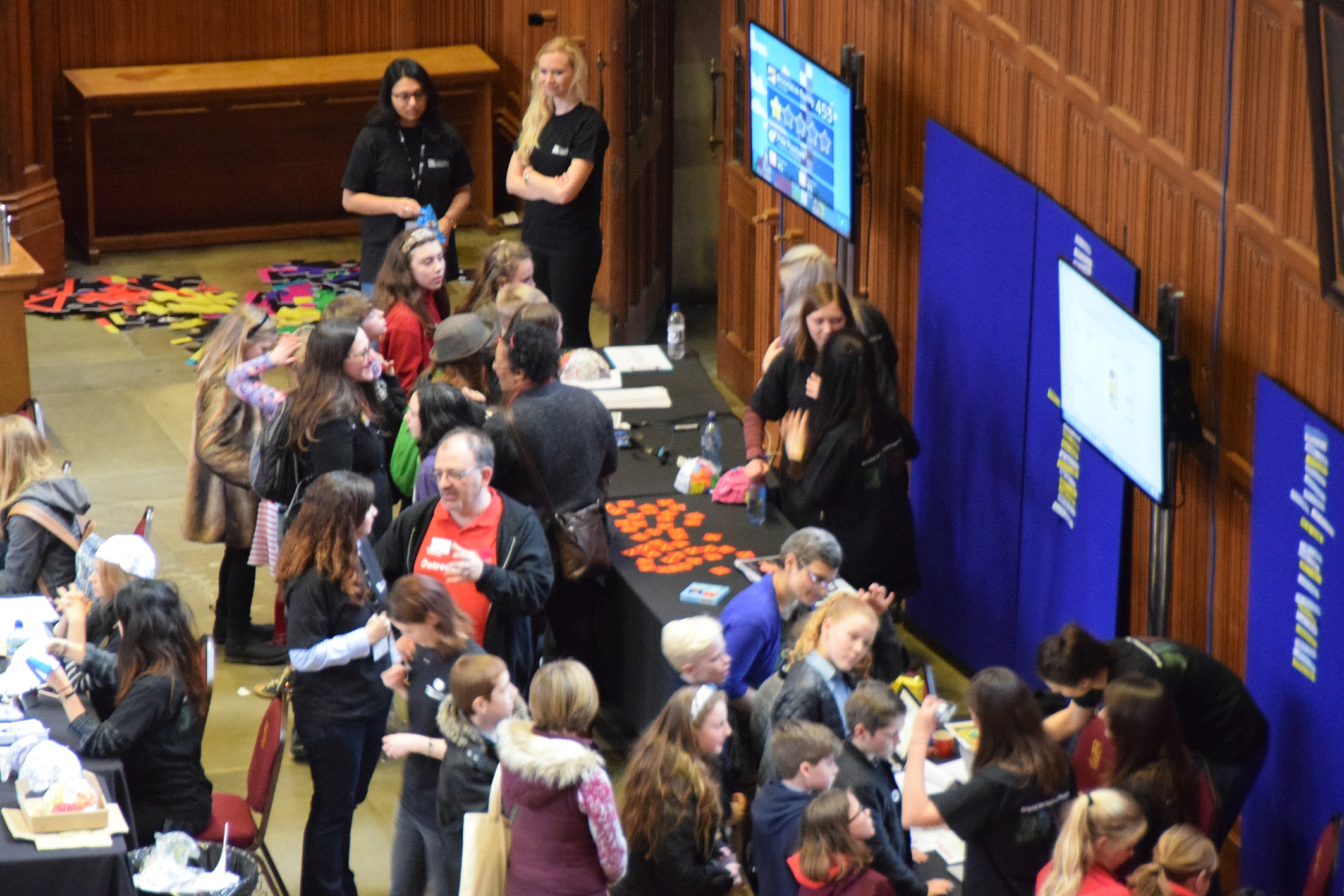 Primary school visitors viewing the exhibition stands